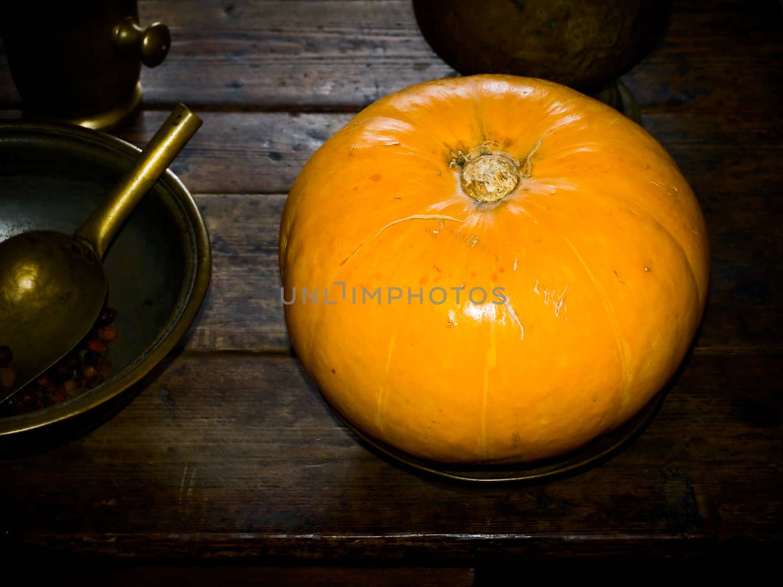 yellow pumpkin on the table in an old house 