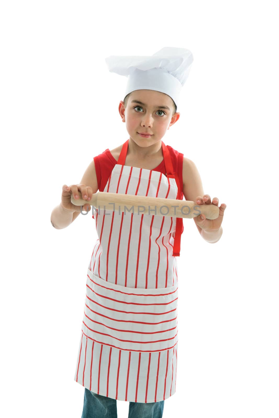 Little cook wearing a chef hat and striped apron ahd holding a wooden rolling pin.