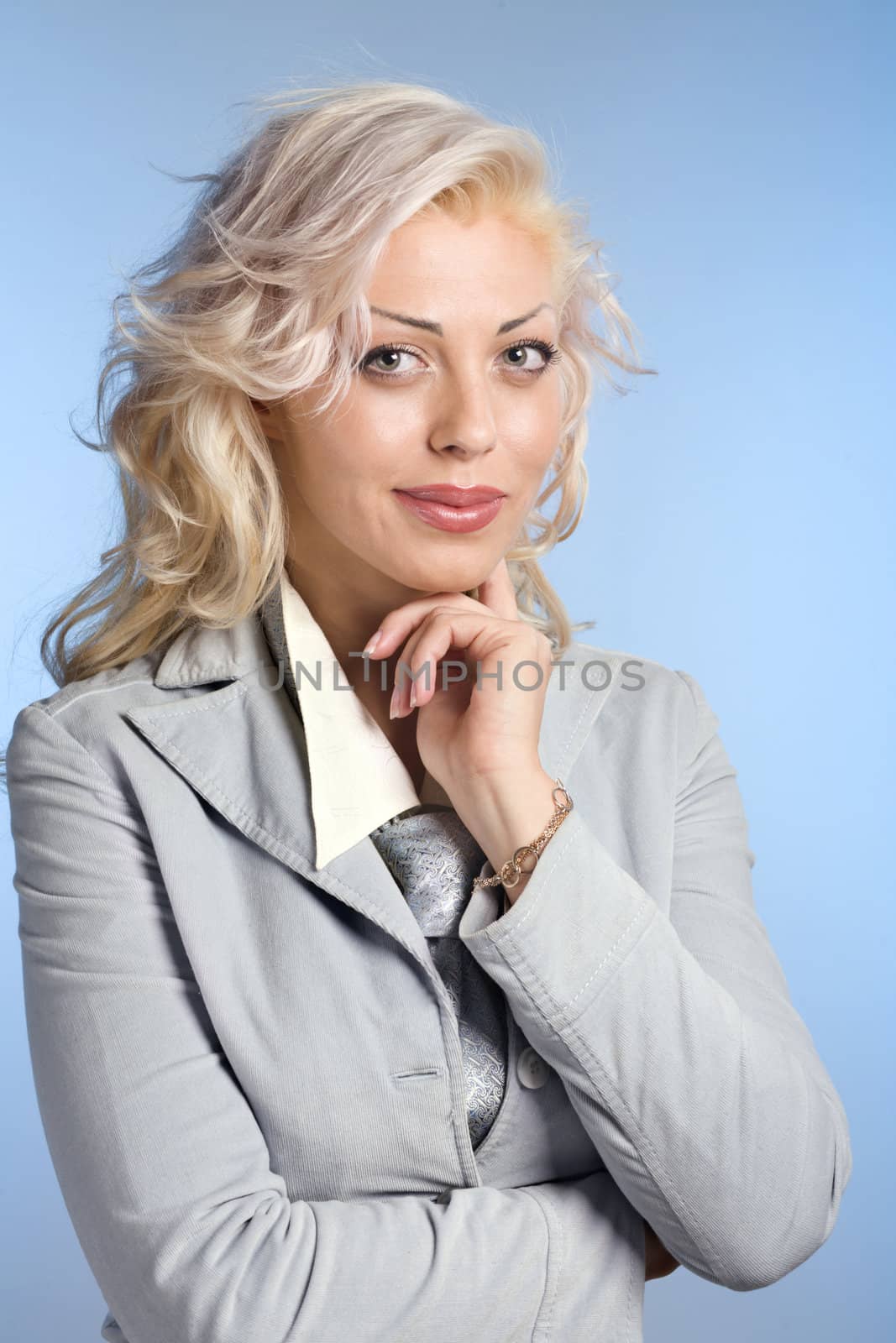 Positive blond woman on blue background