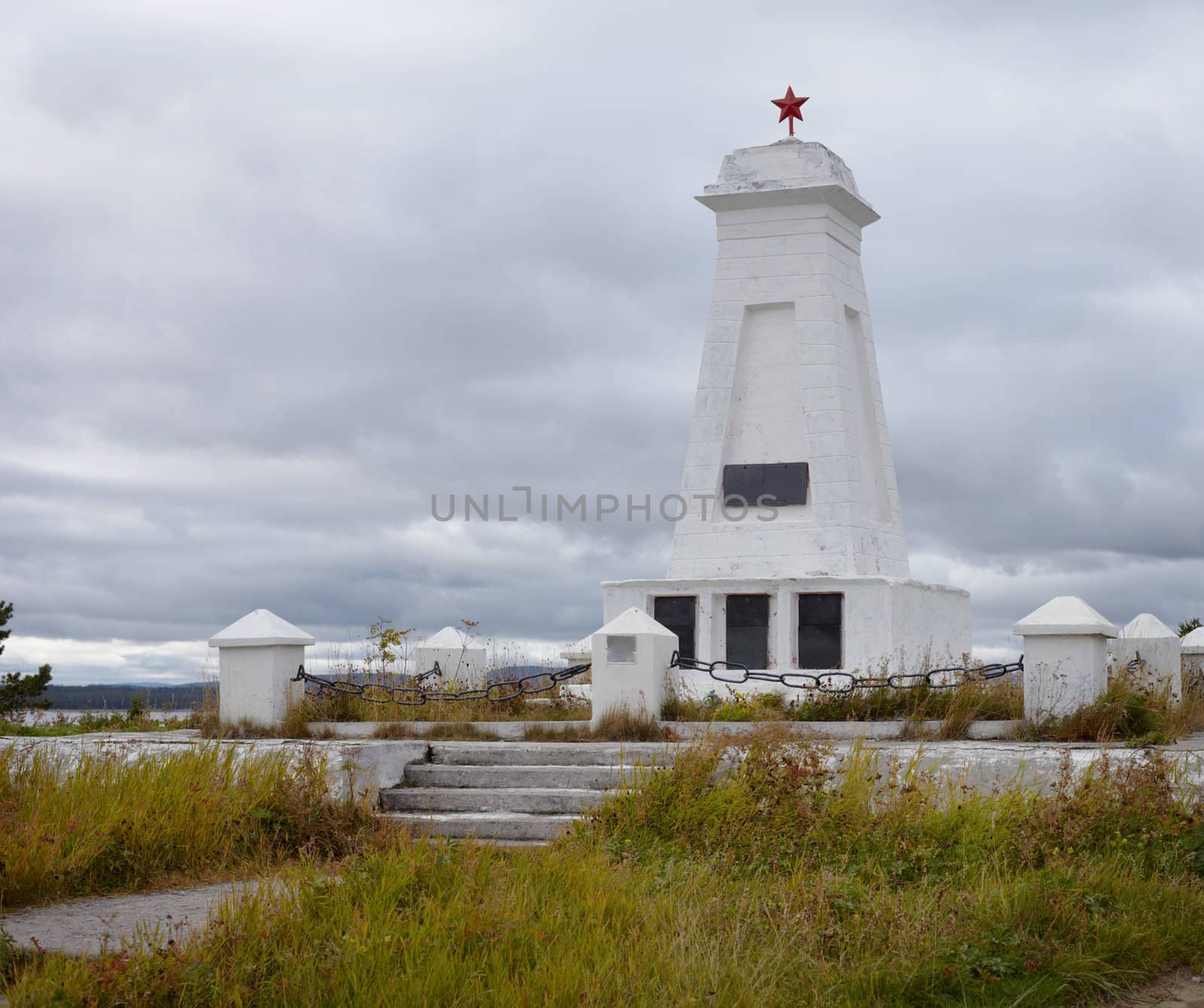 Soviet vintage old concrete gray monument with red star