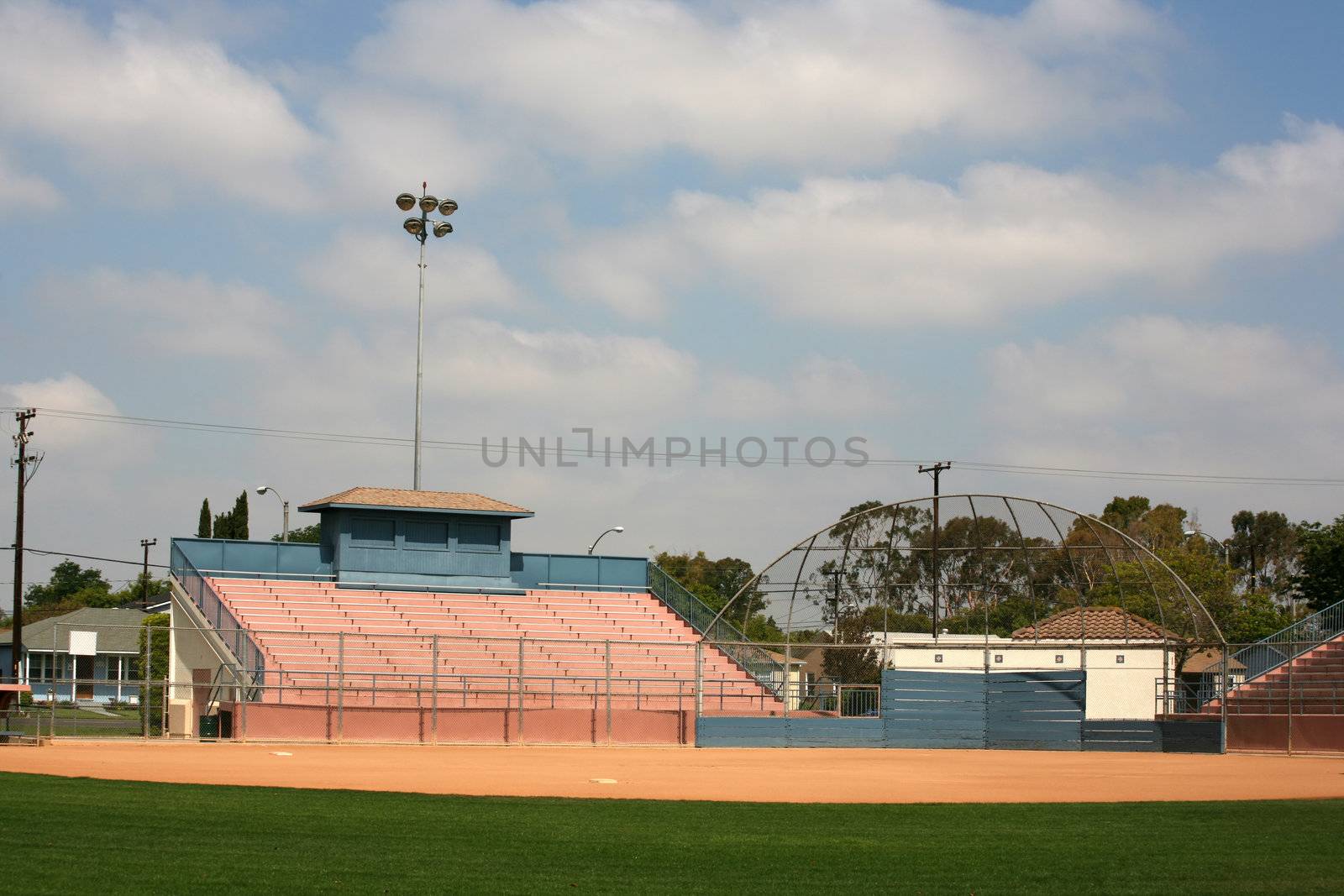 Sports backstop and stadium bleachers ready for a softball or baseball game