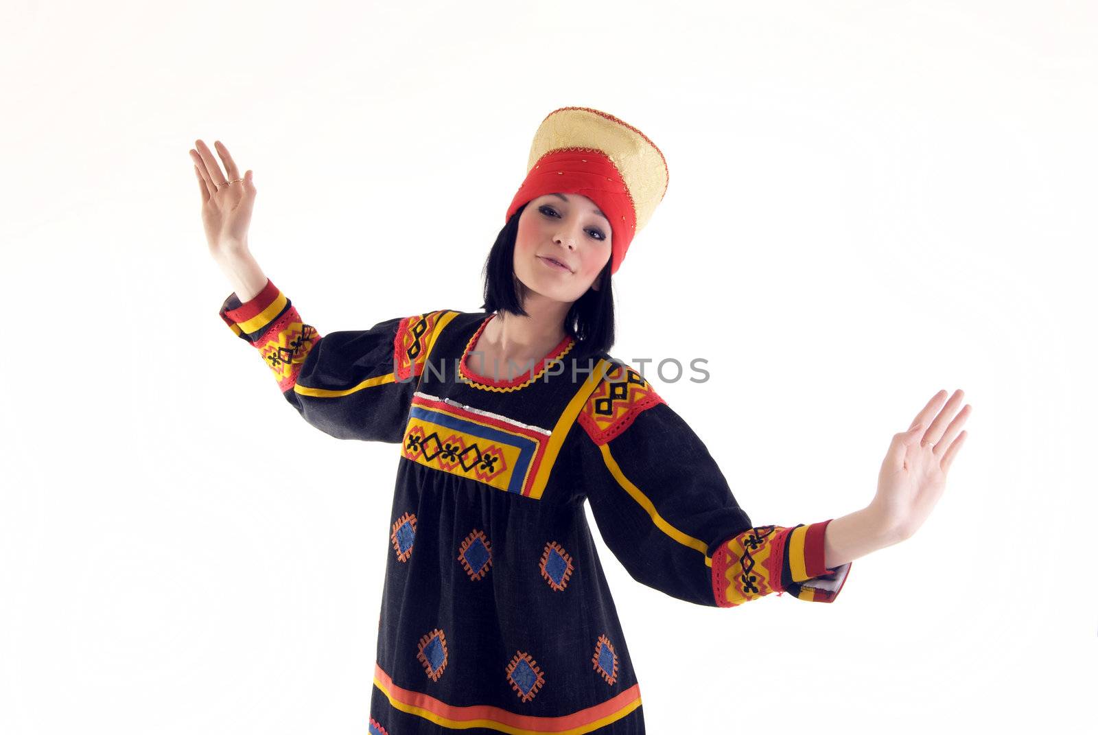 Portrait of a young beautiful brunette in Asian style dancing