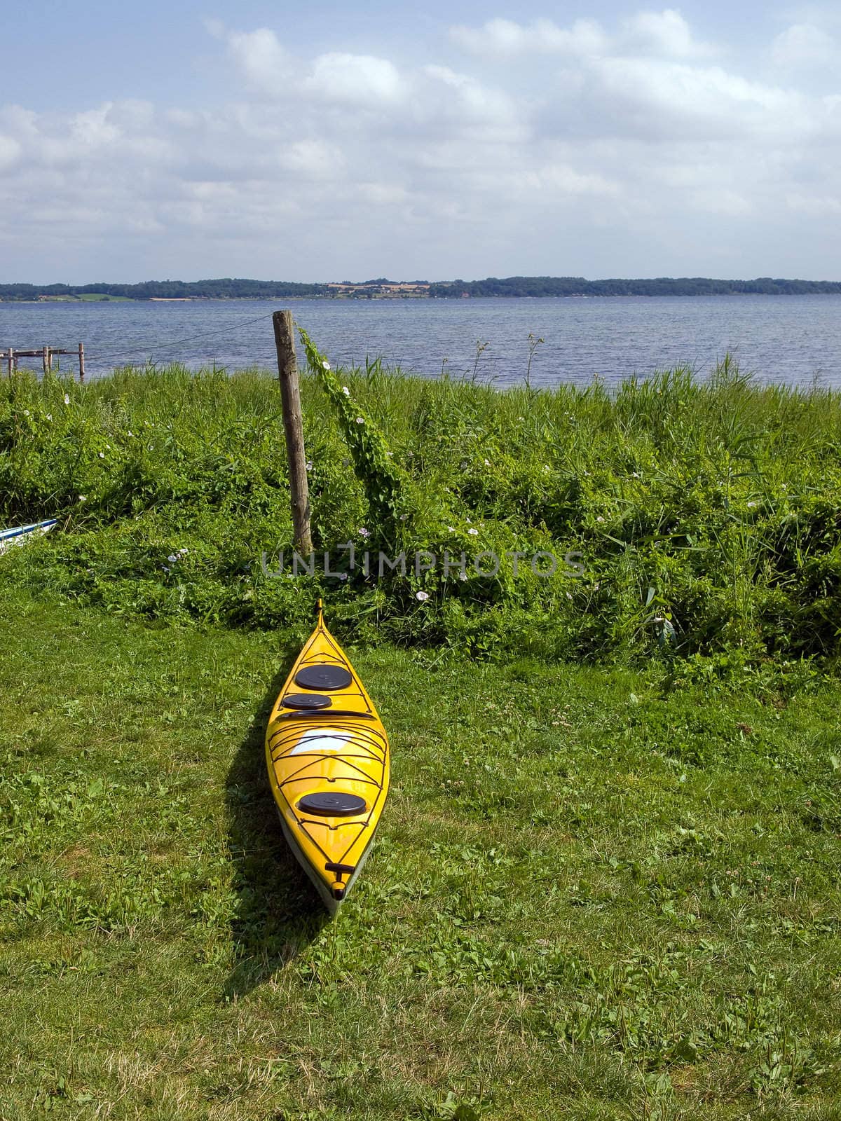 Kayak on the beach ready for action - sea sport background image