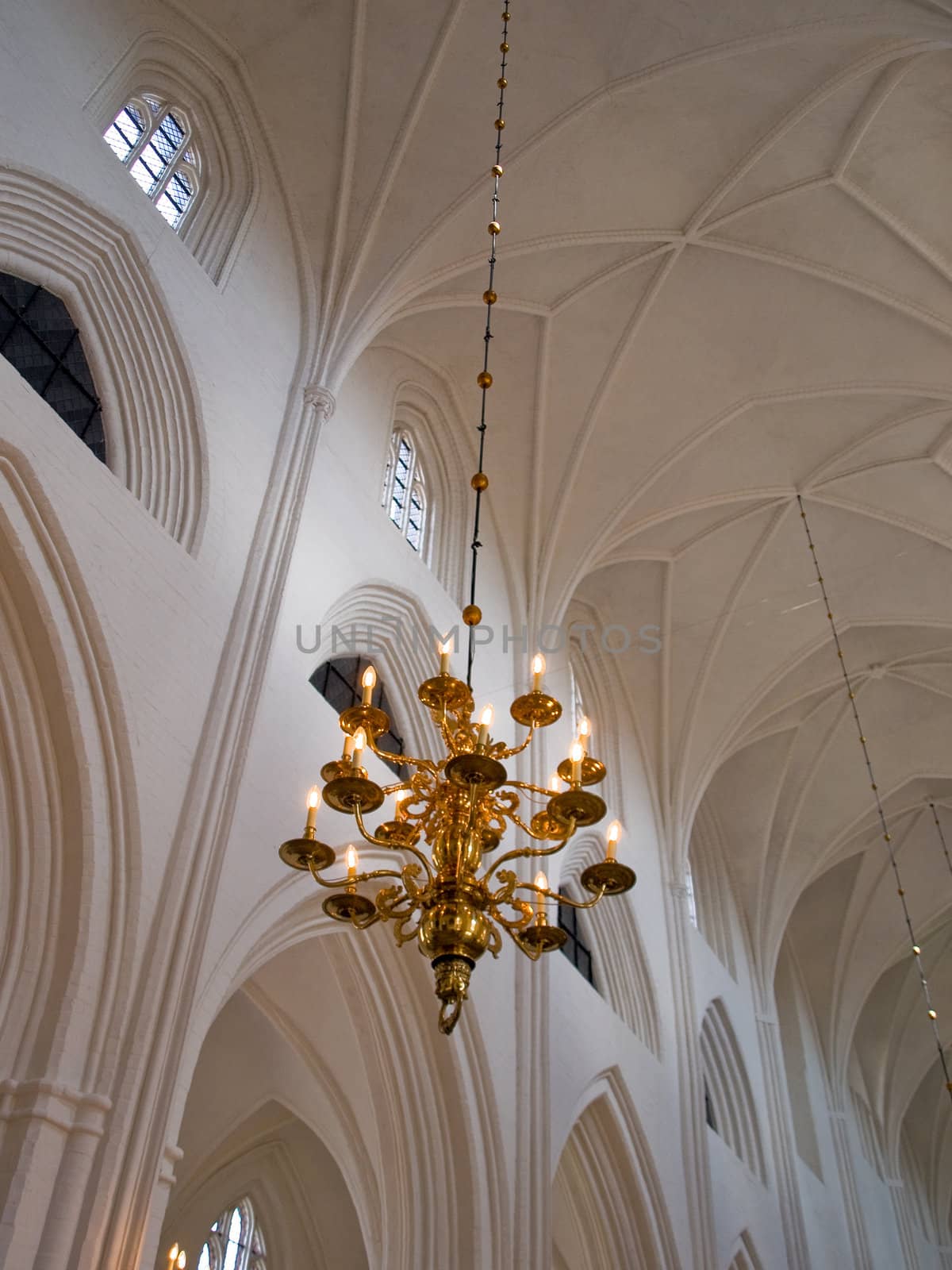 Classical Style Old Beautiful Crystal Chandelier hanged in a church