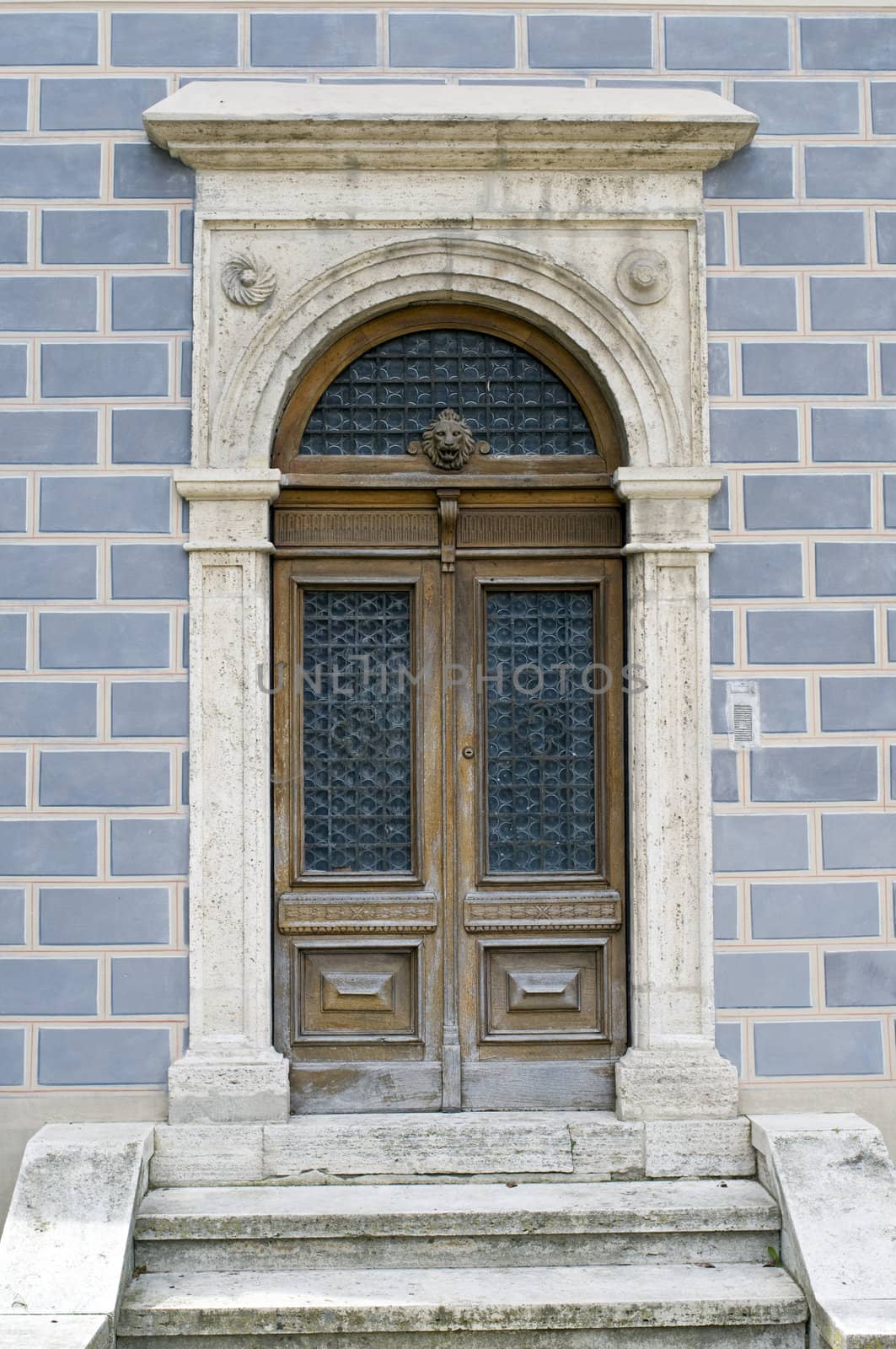 Old wooden door decorated. Italian style