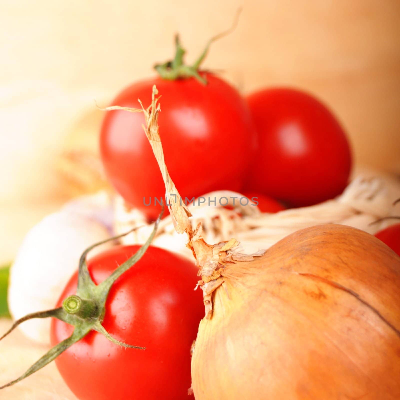 tomatoes and garlic in kitchen showing healthy food concept