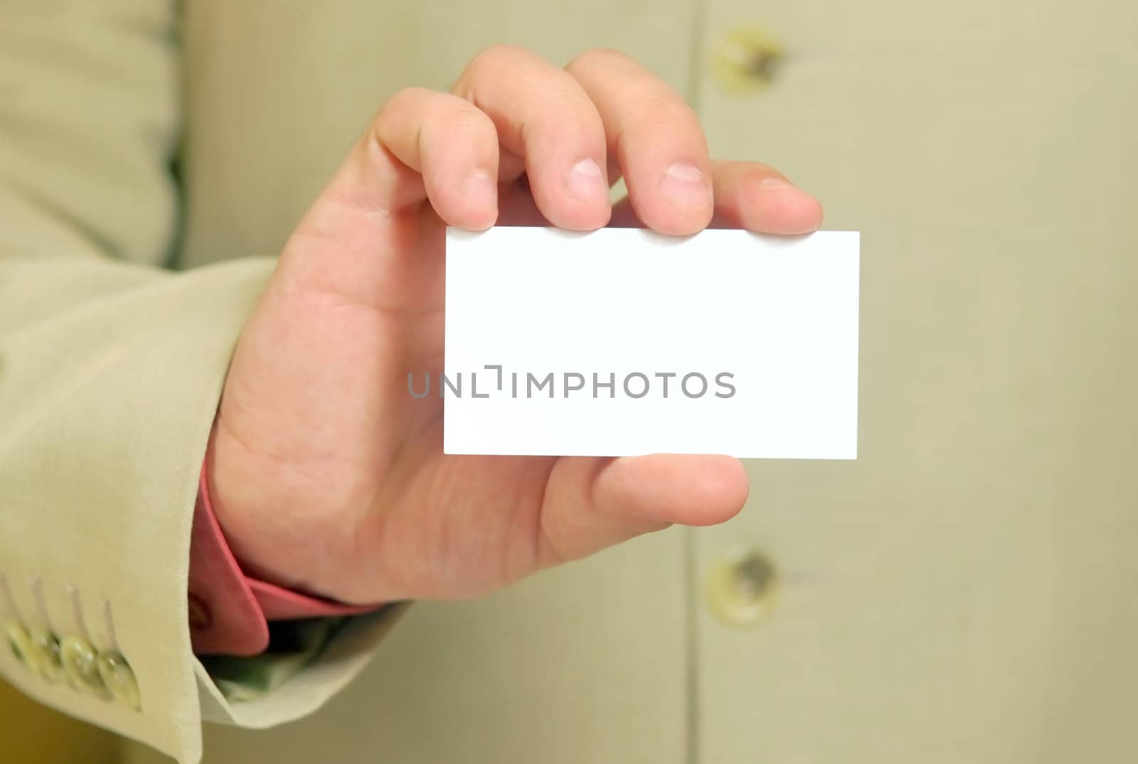 white business card in a hand