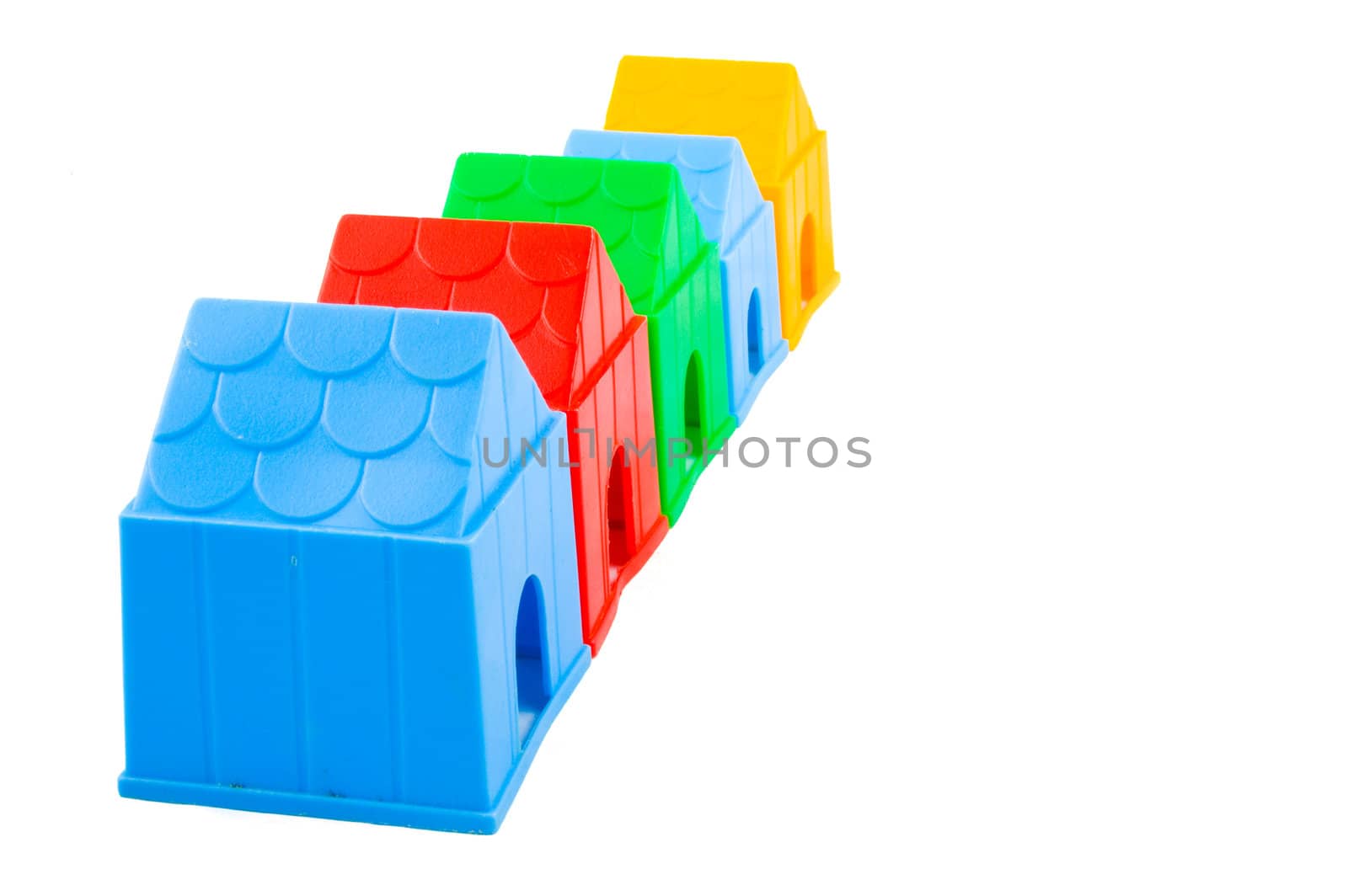 row of colorful doghouses isolated on white