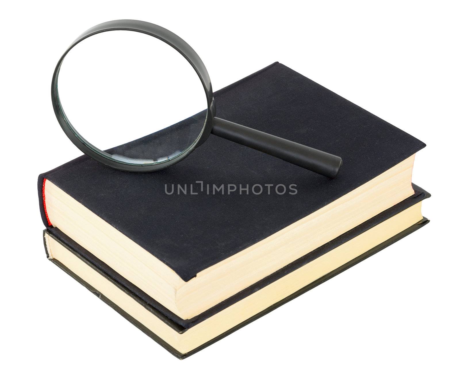 Two black books and magnifier glass on white background