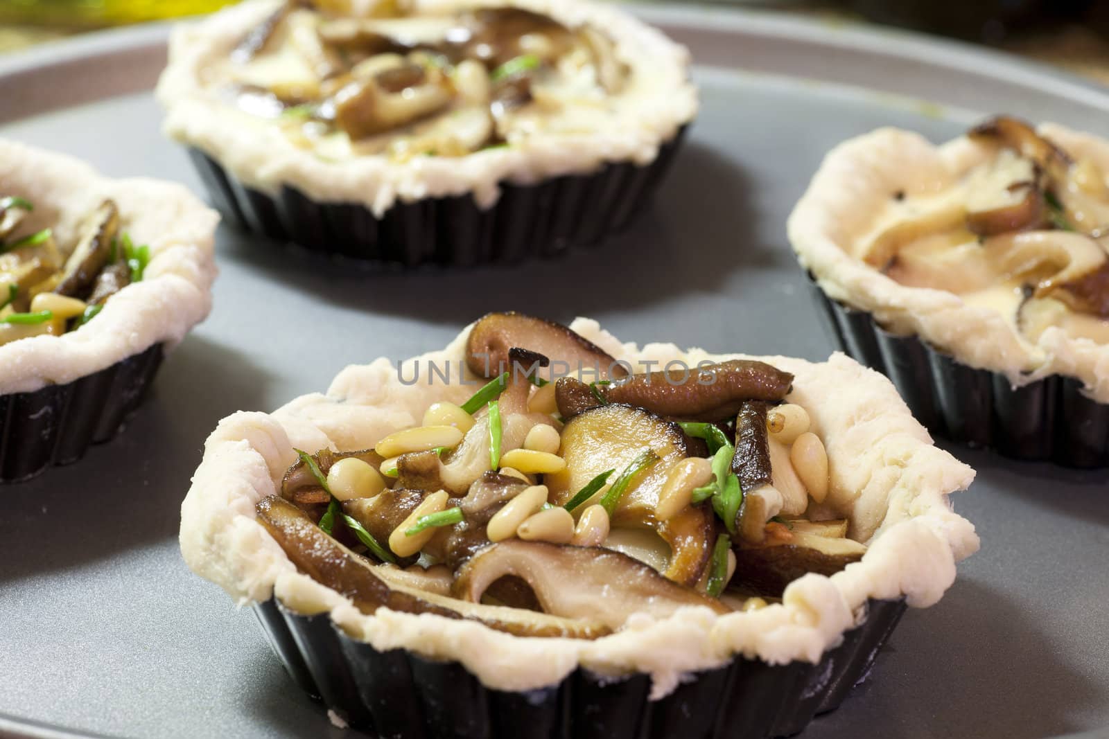 Fresh shitake mushrooms, pine nuts and chives, just add eggs and bake.