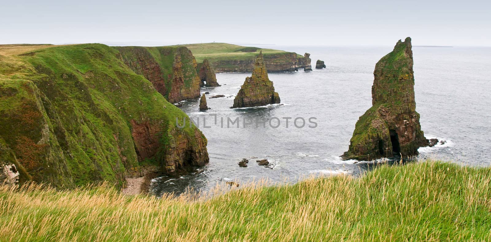 viewpoint on duncansby head scotland towards several sea stacks
