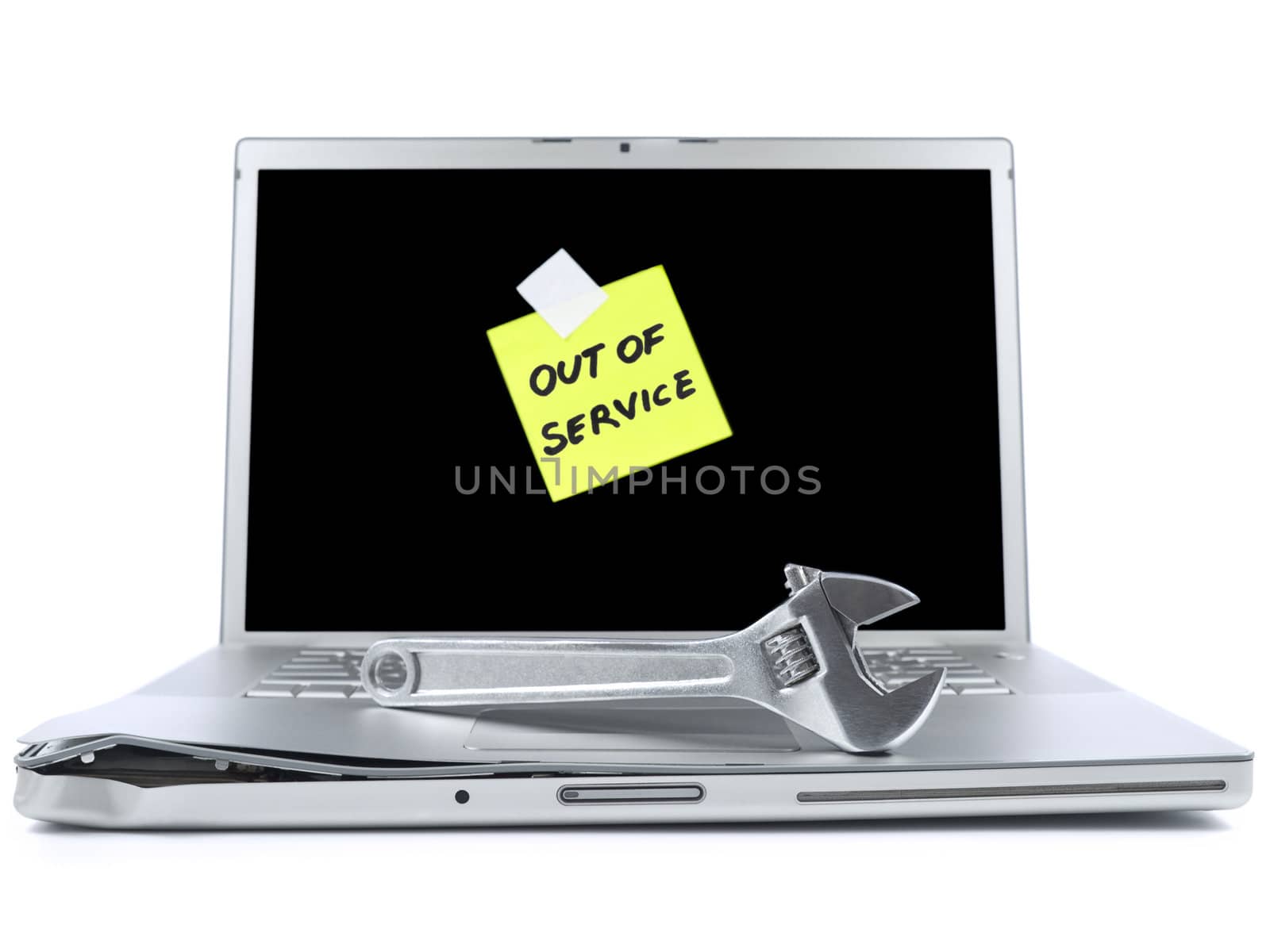 Damaged laptop with a post-it saying Out of Service and a spanner over it. Isolated on white.