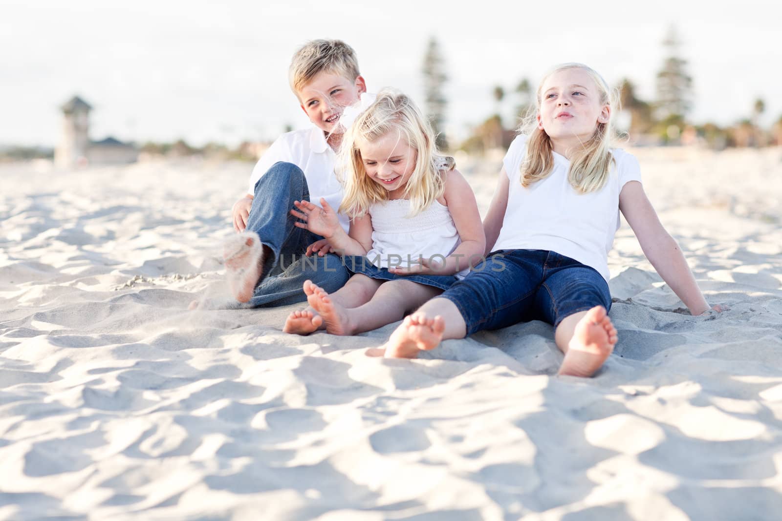 Adorable Sisters and Brother Having A Lot Fun at the Beach.