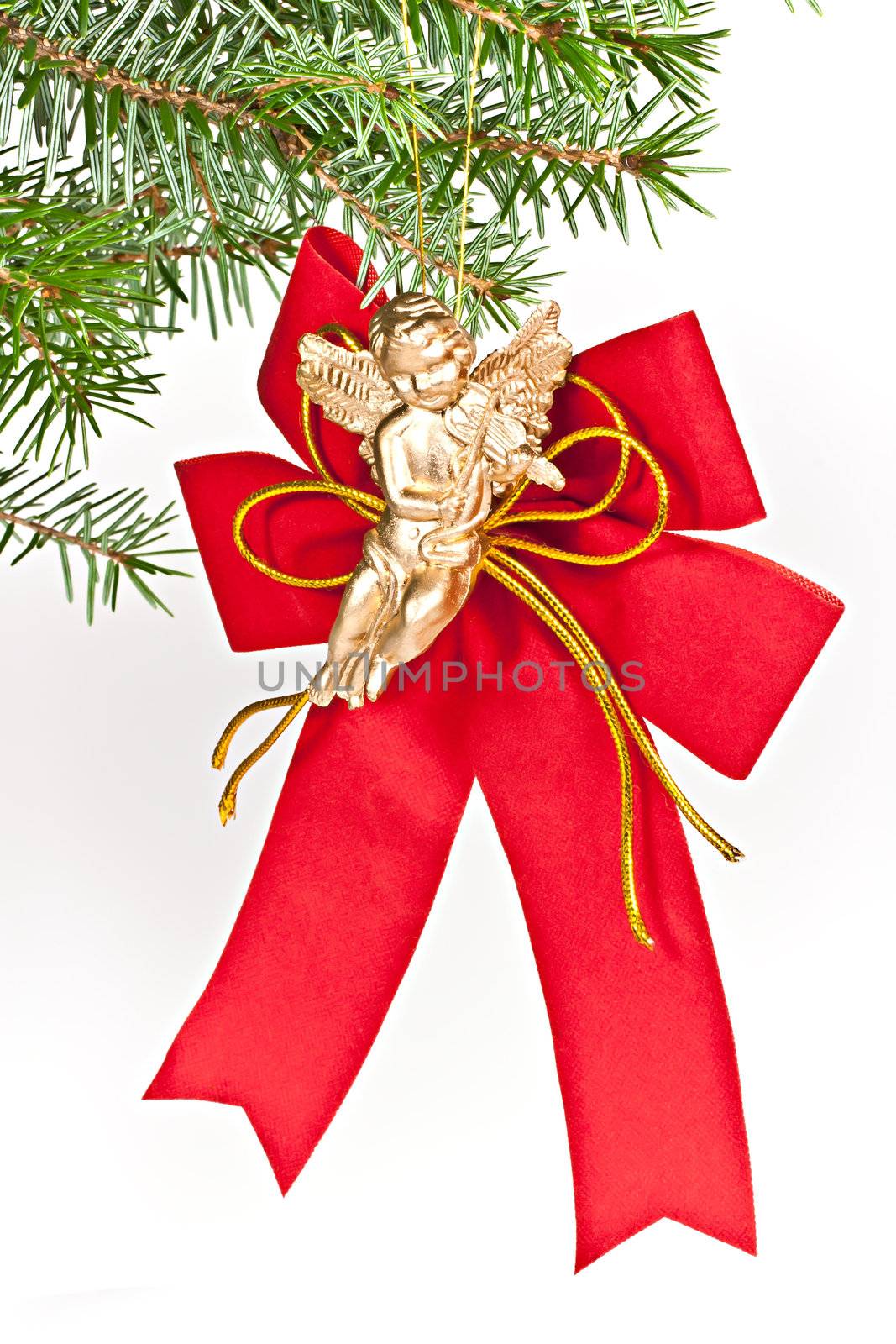 Christmas decoration angel on spruce branch. Isolated on a white background.

