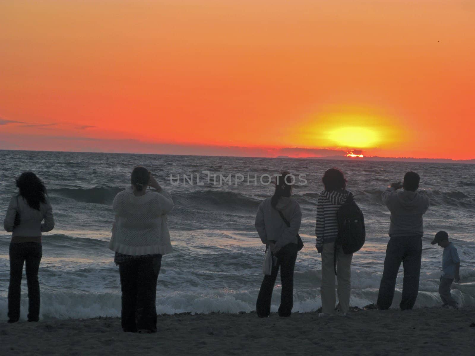 an isolated shot of People watching Sunset