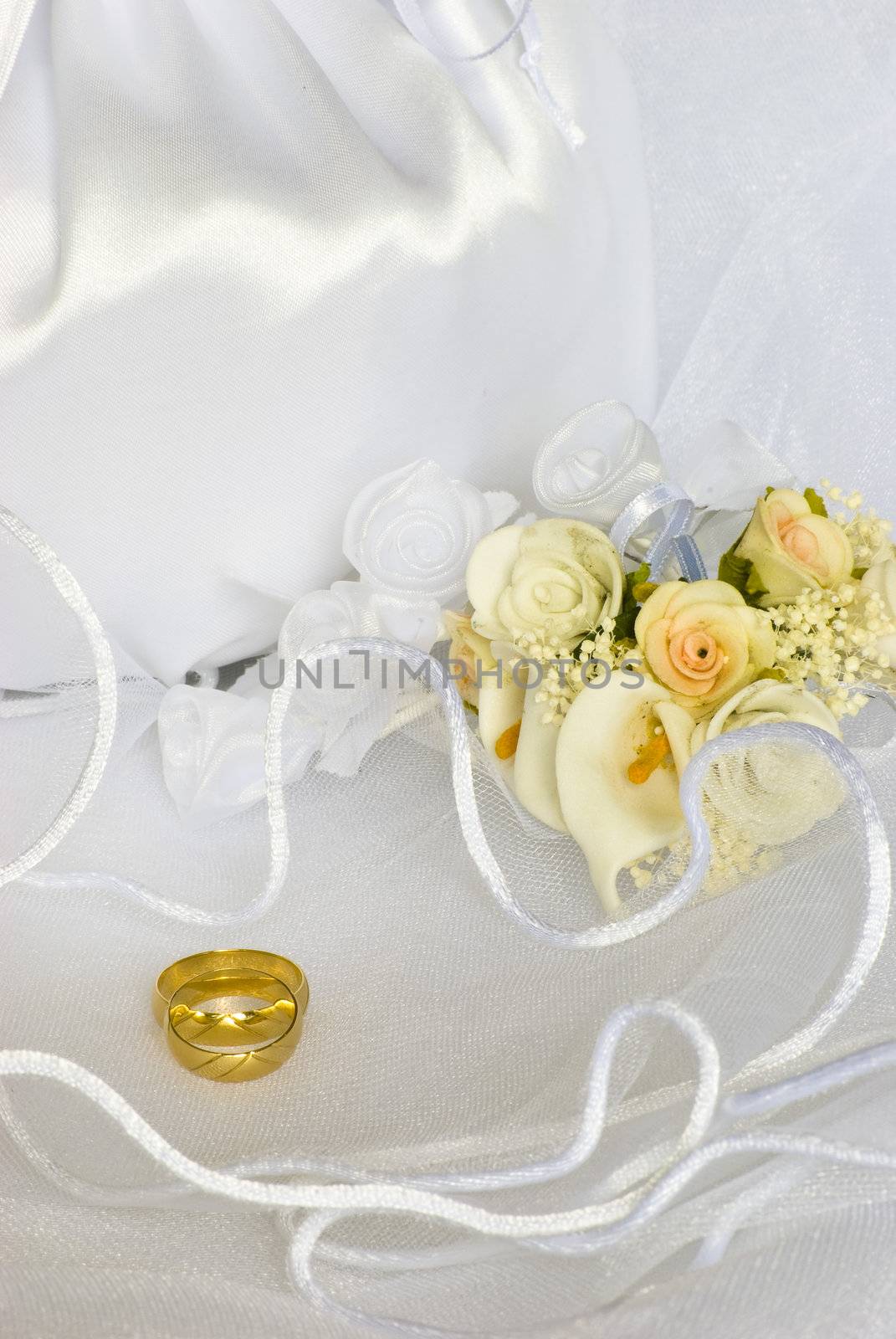 wedding rings flowers and bridal bag over veil by Dessie_bg