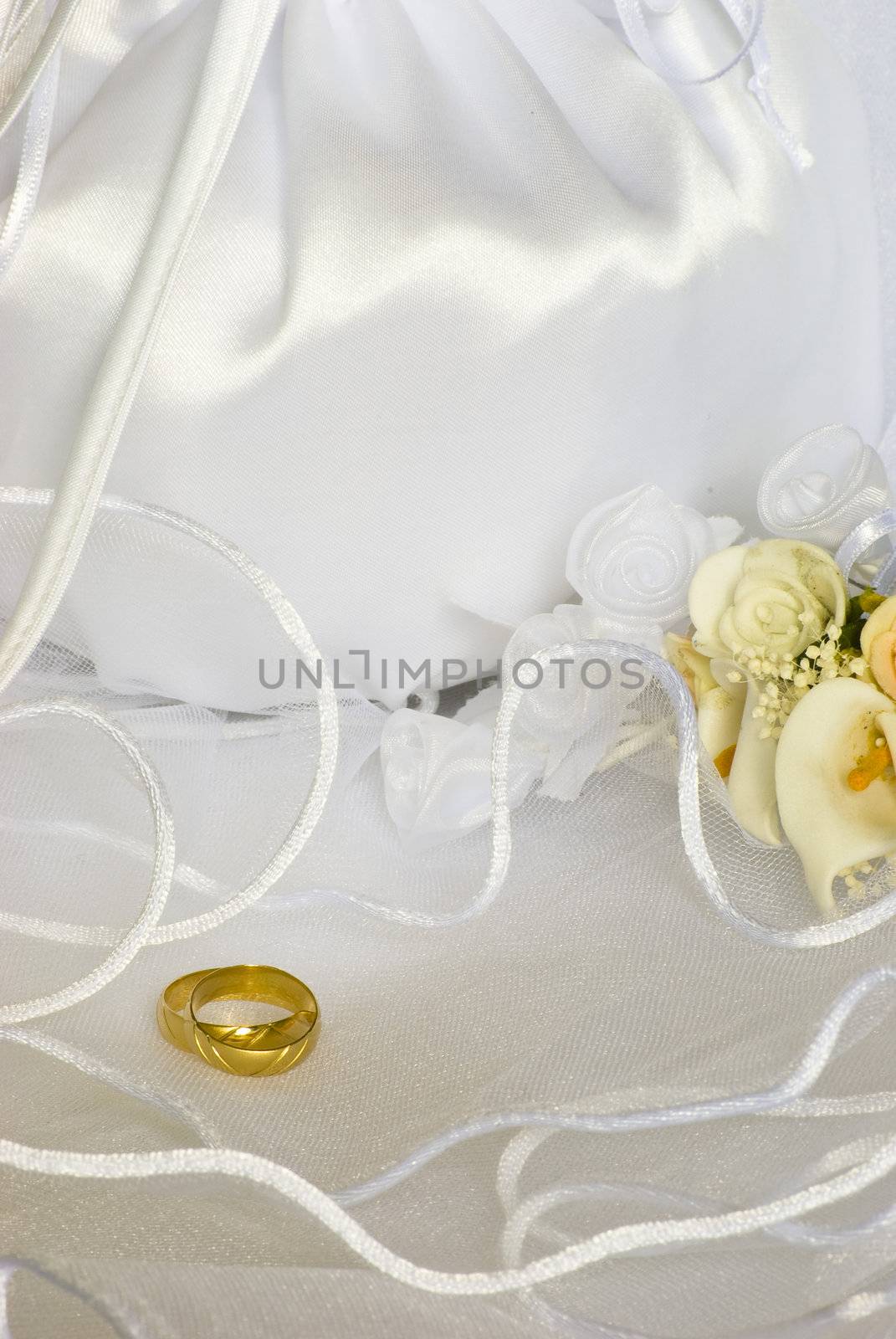 wedding rings flowers and bridal bag over veil by Dessie_bg