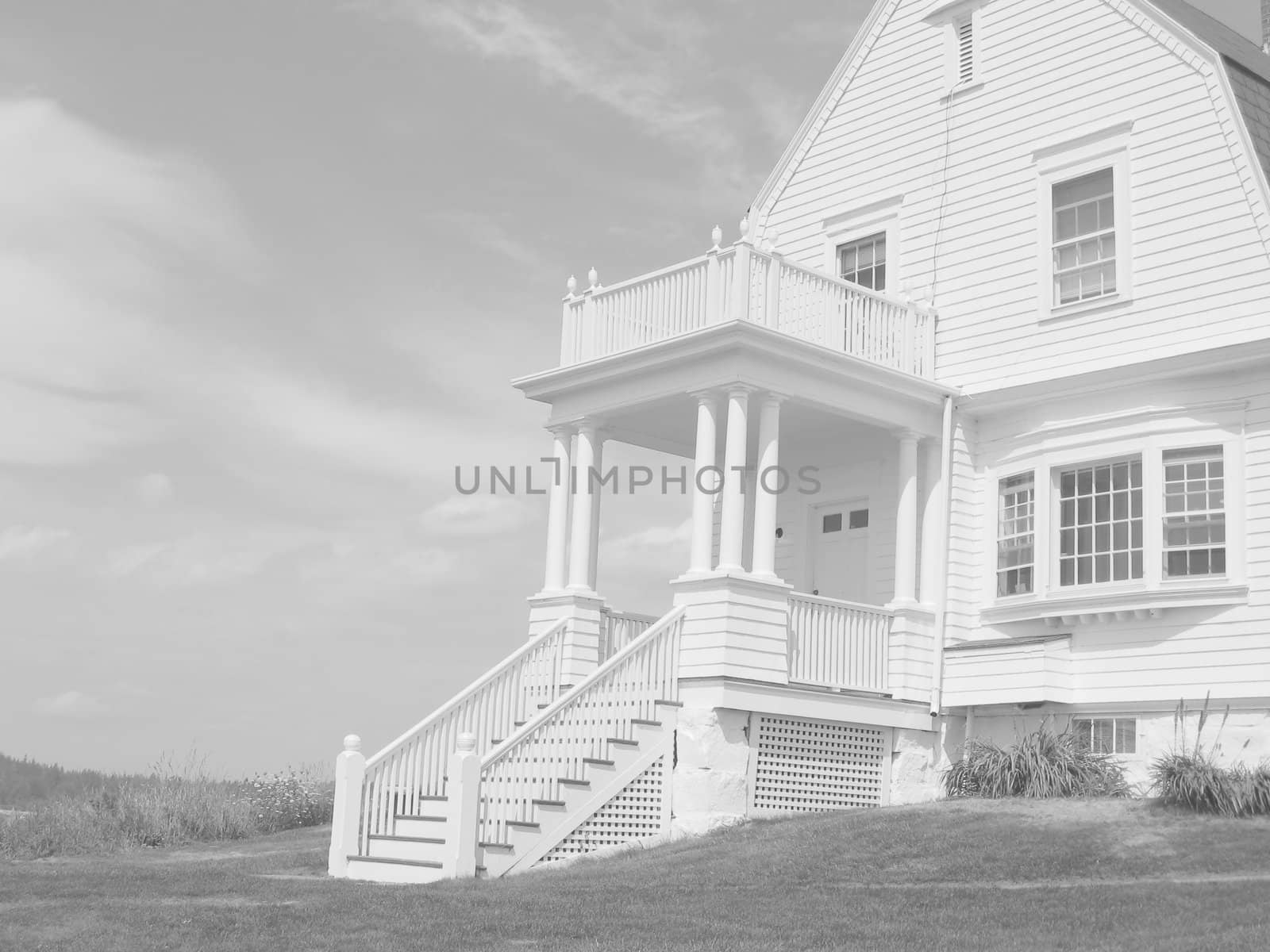 a late 19th century light keepers house, in black and white
