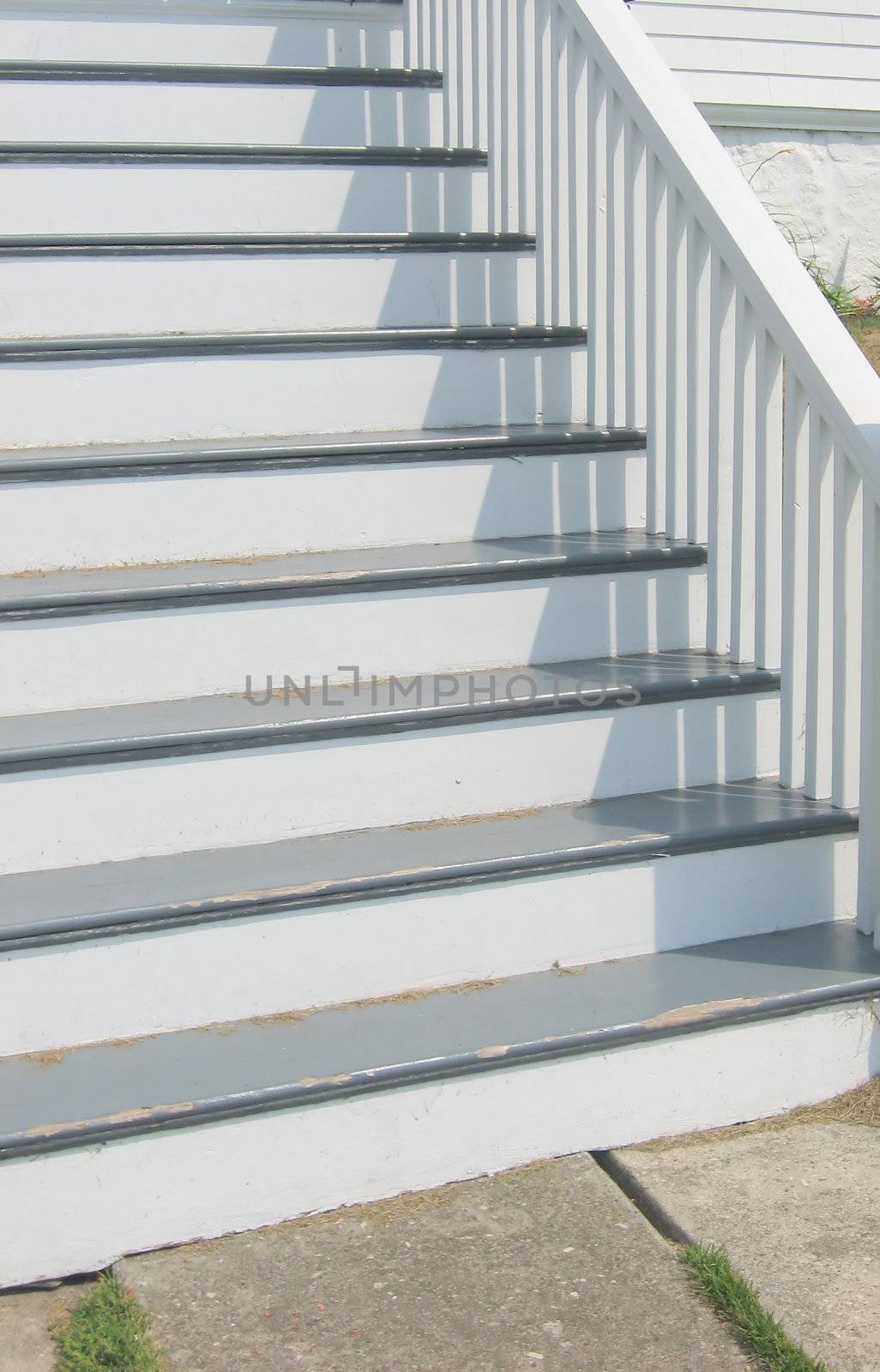 a flight of painted stairs on a 19th century home, showing afternoon shadows - concept possibilities