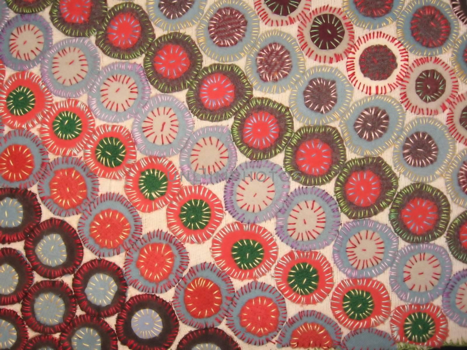 an antique penny rug, showing diagonal design