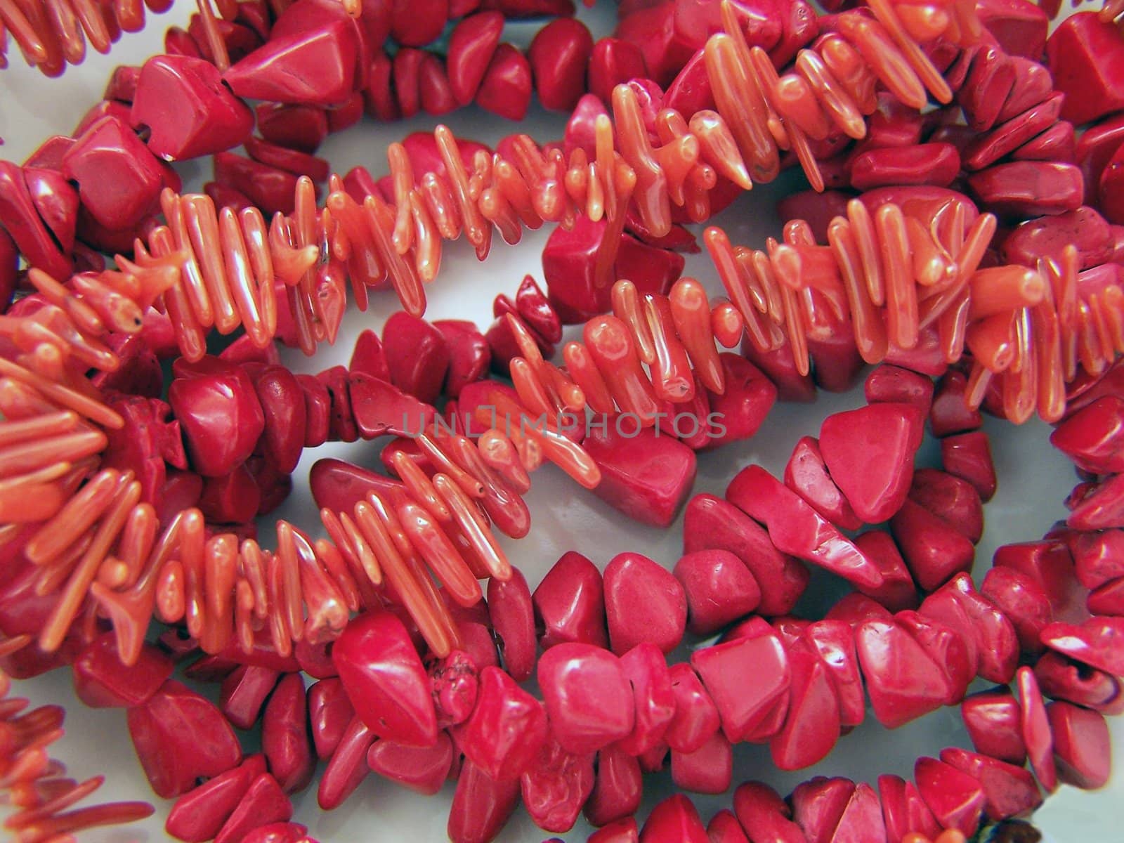 Close up of different red coral gems.