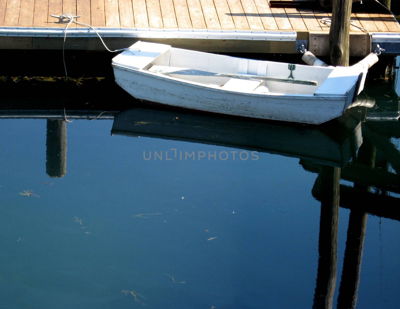 Skiff at Dock with Reflections by loongirl