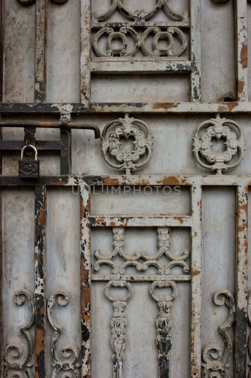 Close up detail of rusted door gate with lock