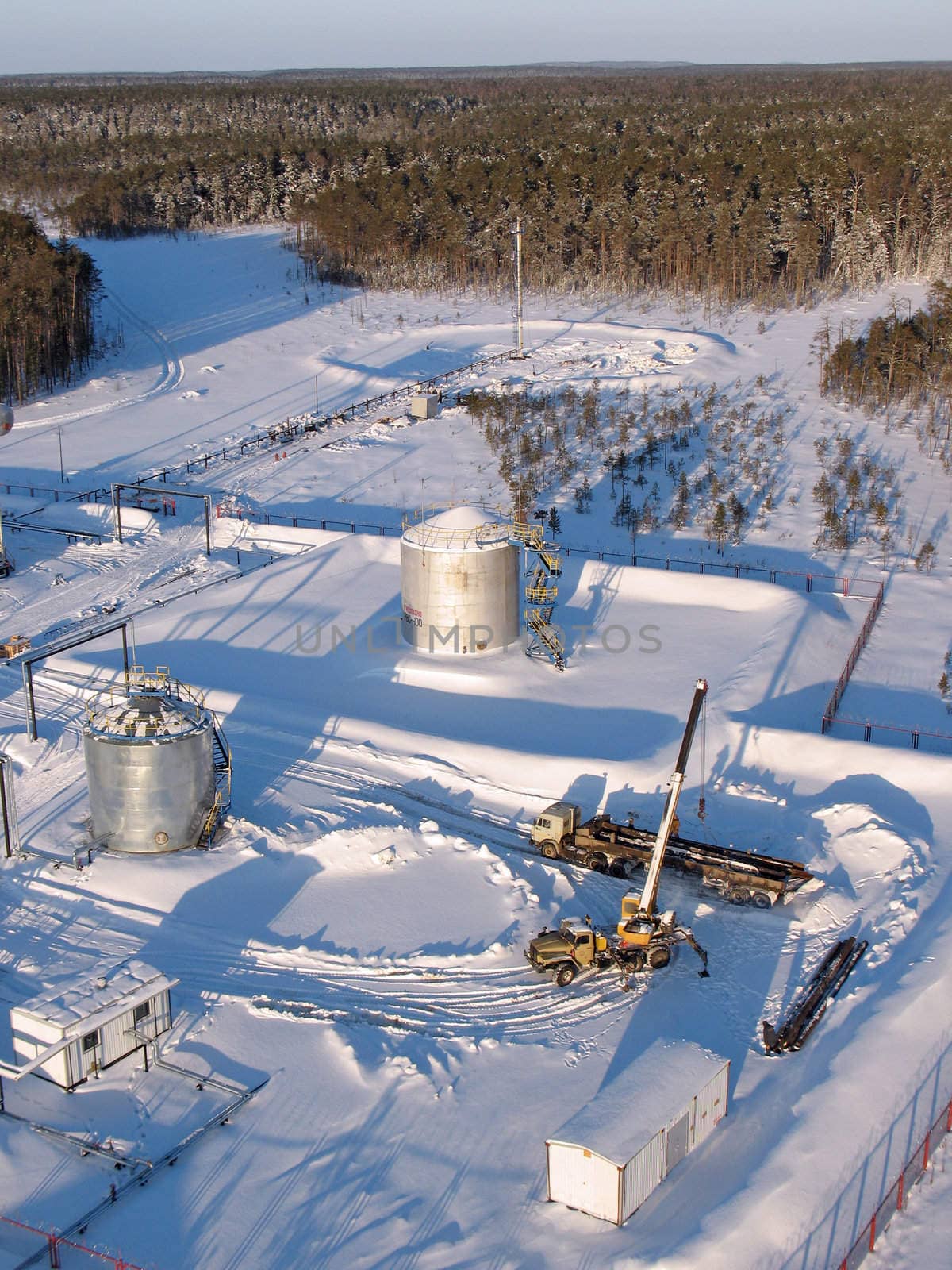 Industrial construction and mechanism. Work of oil industry. Mounting of pipeline in wild Siberian taiga.
