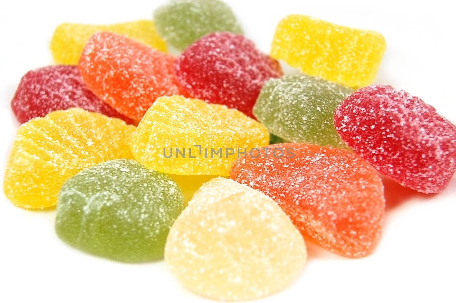 heap of colorful marmalade candy over white