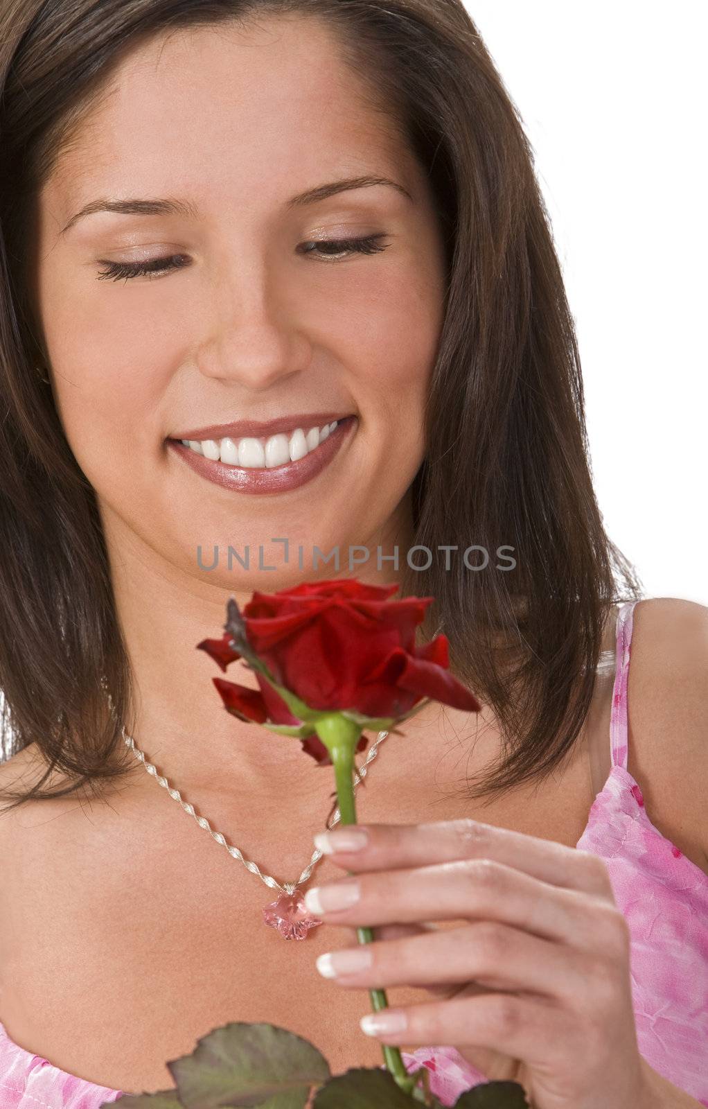 Portrait of a girl with a red rose.Very sharp focus on the eyes.Shot with Canon 70-200mm f/2.8L IS USM