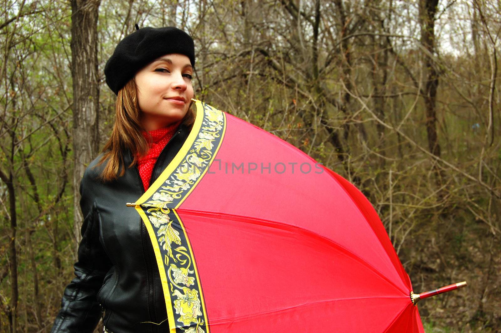 Woman with red umbrella thinking outdoor