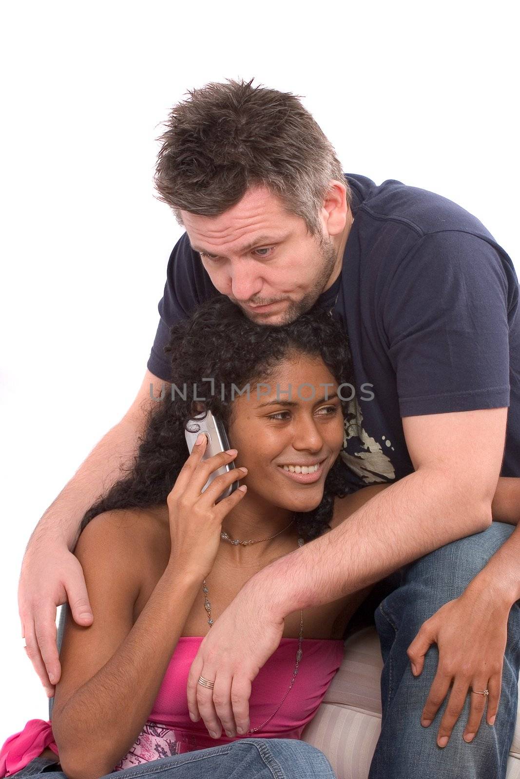 Man looking very bored while his girlfiend keeps talking on the phone