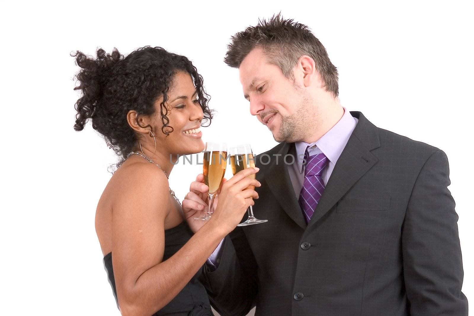 Attractive diverse couple celebrating by Fotosmurf