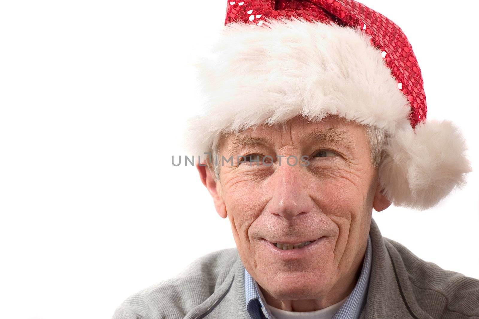 Smiling older man with santa hat by Fotosmurf