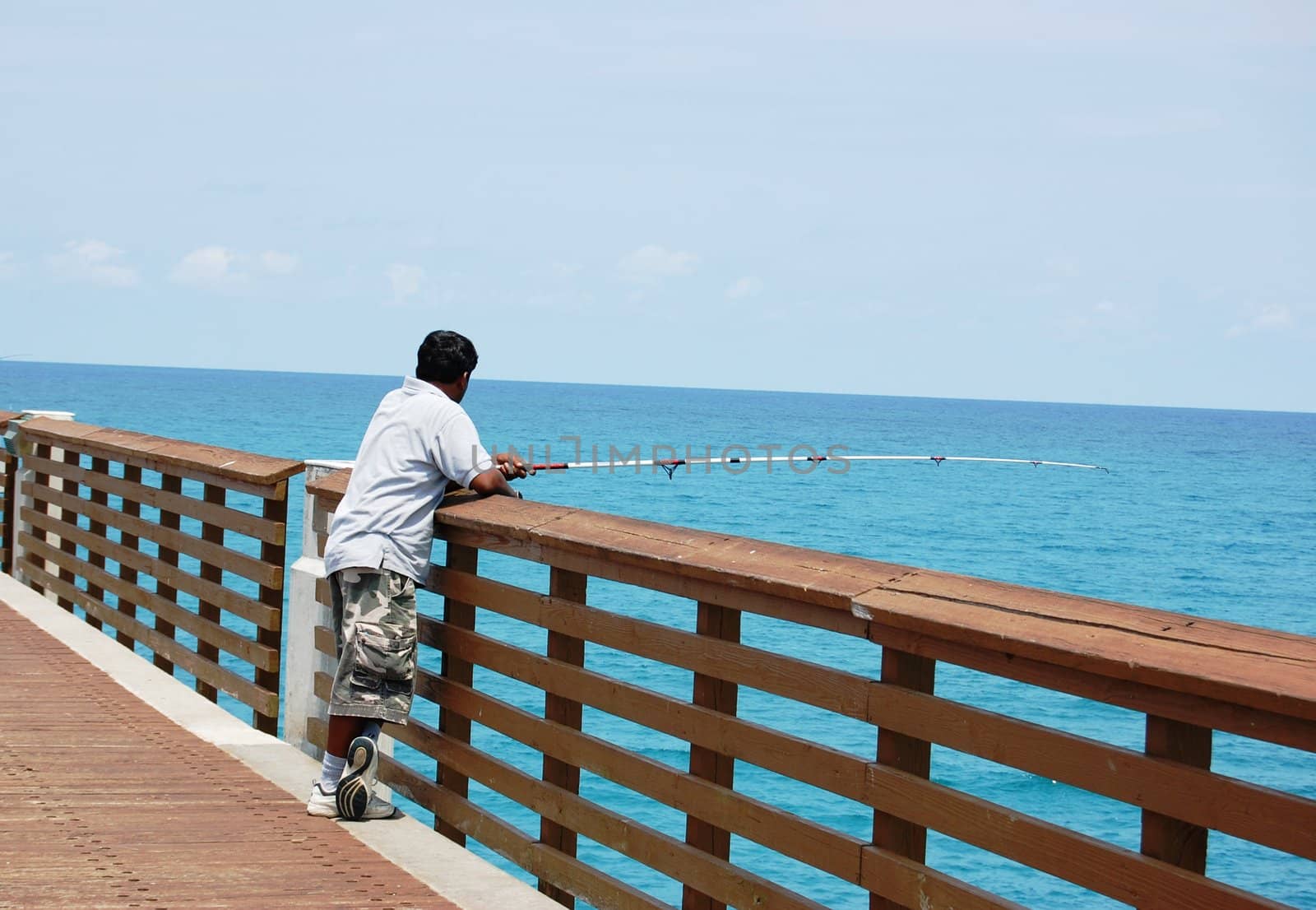 Men fishing on pier