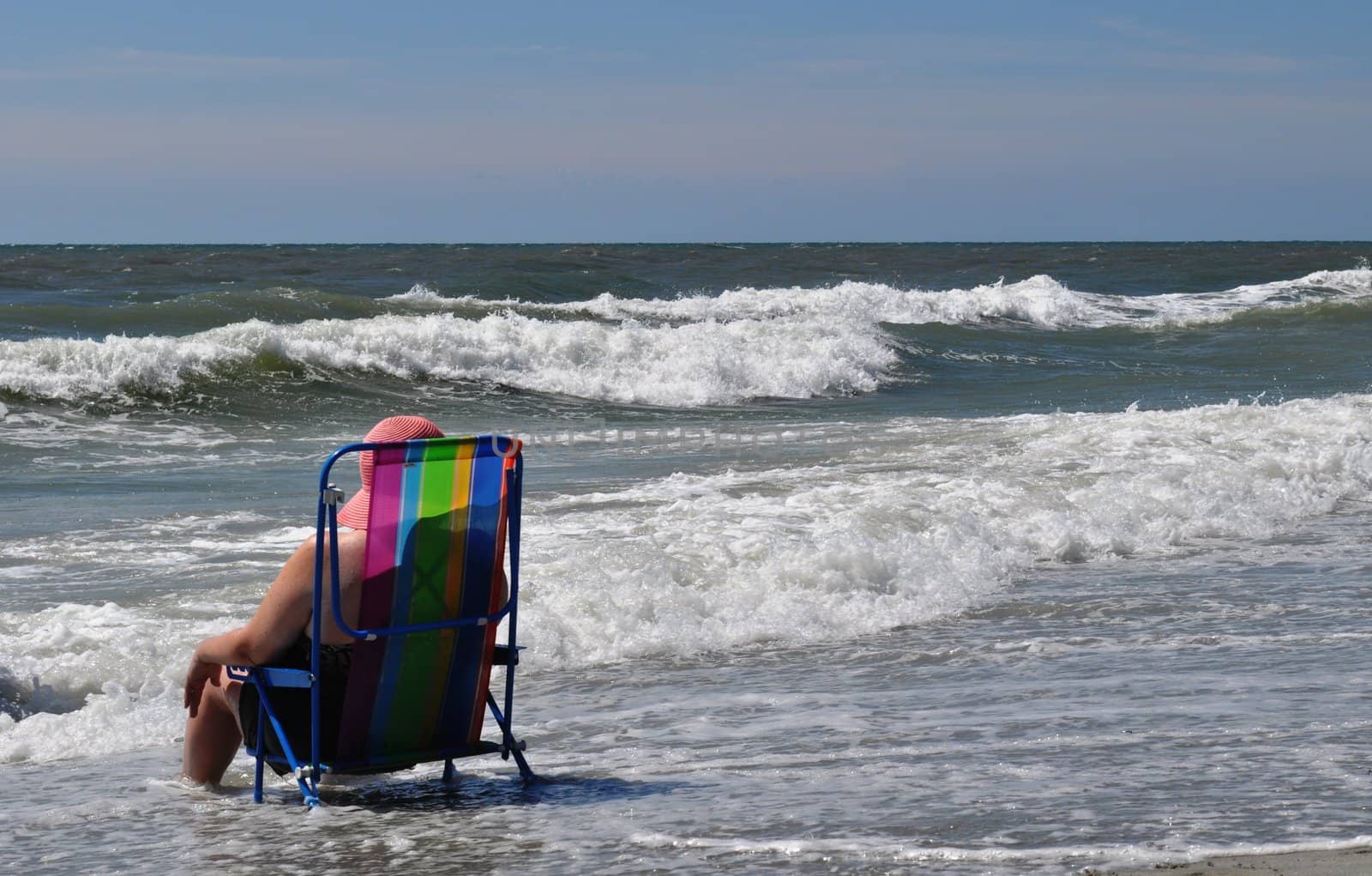 Sitting in the waves by RefocusPhoto