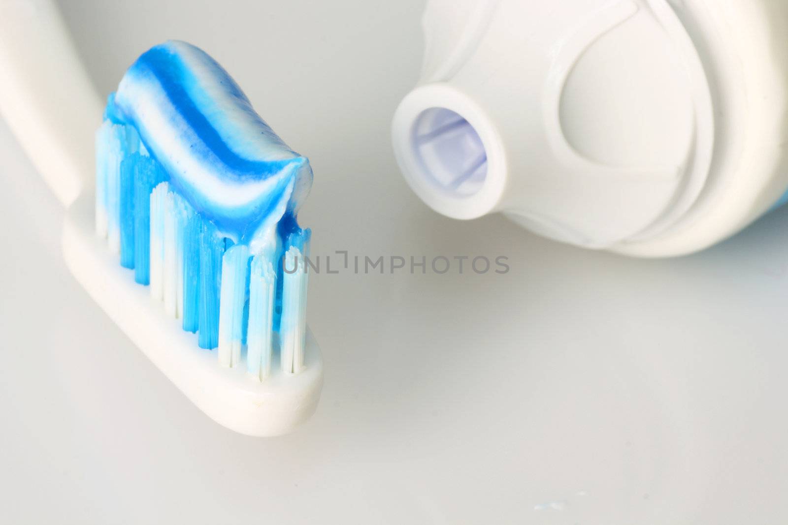 Dental care products on bright background