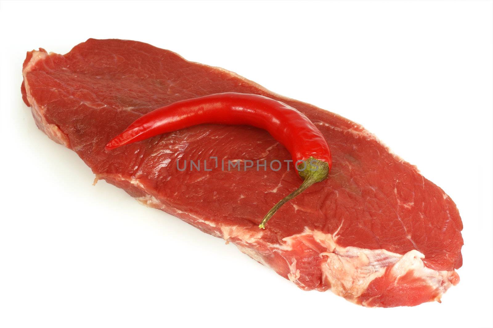 A prime cut of a raw ribeye beef steak. 