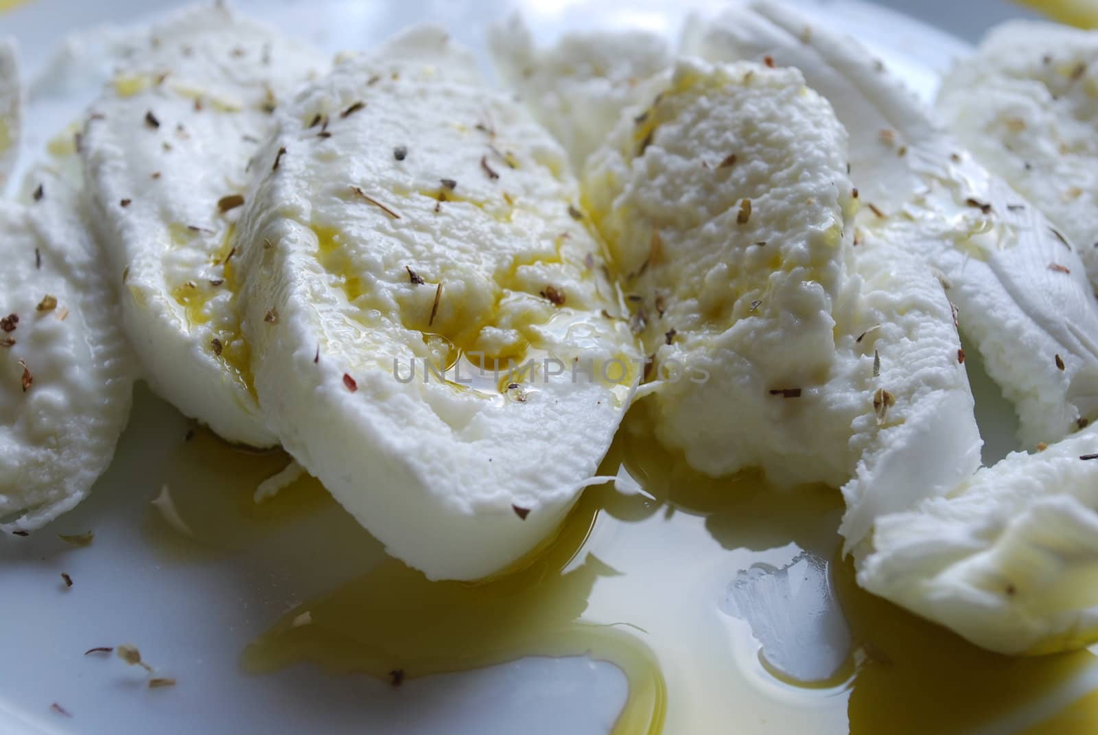 photo of mozzarella cheese and olive oil