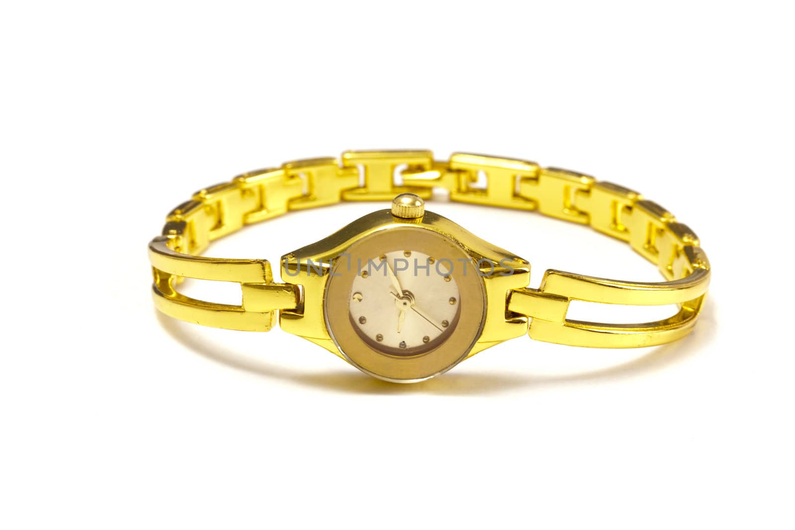 Woman gold wrist watch by ibphoto