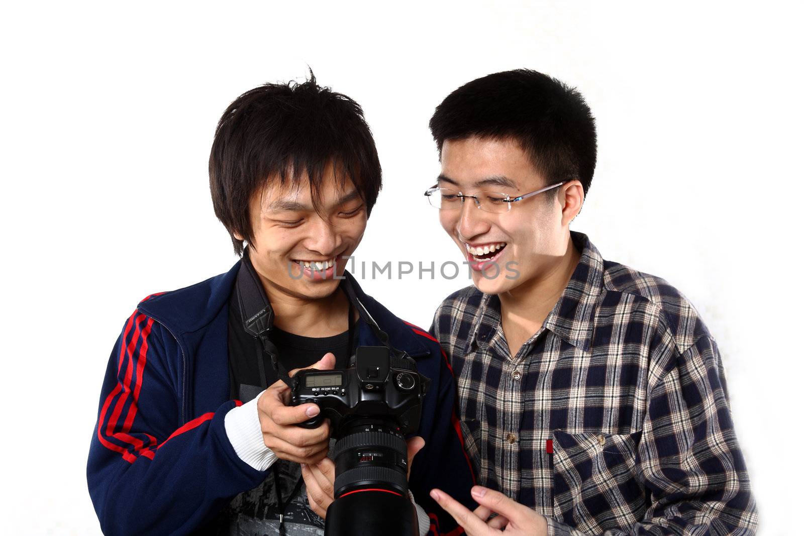 two asian man watching the photo in camera by cozyta