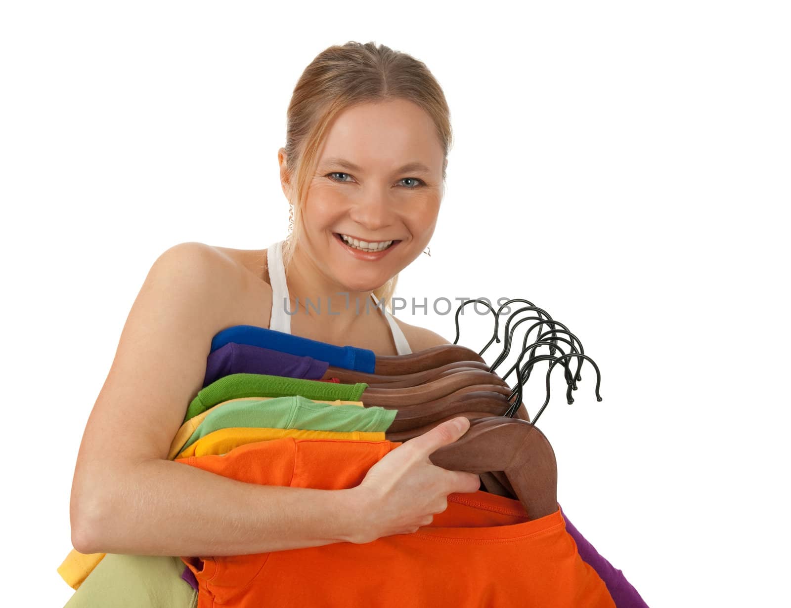 Charming young woman holding colourful clothes by anikasalsera