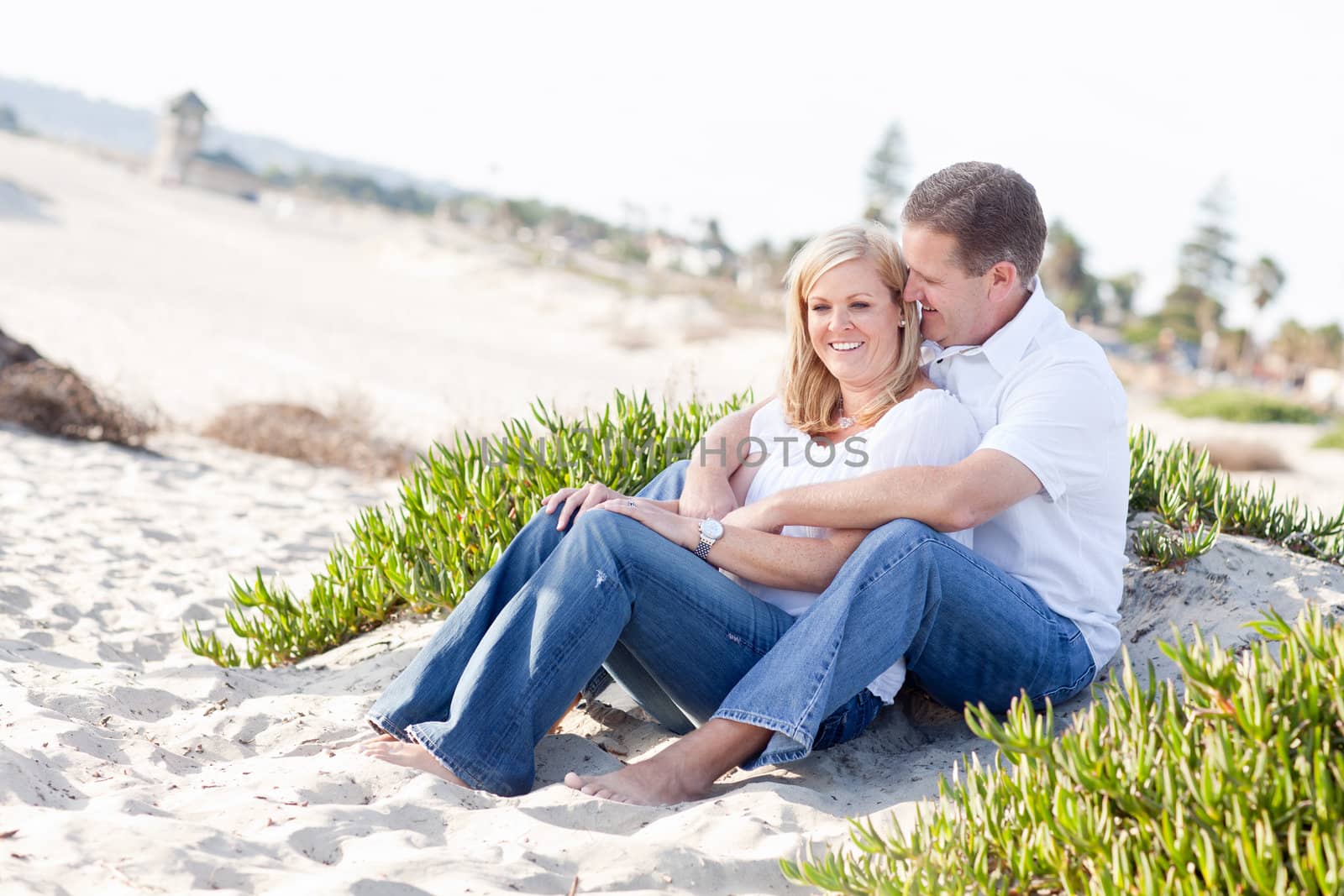 Attractive Caucasian Couple Relaxing and Enjoying the Beach Together.