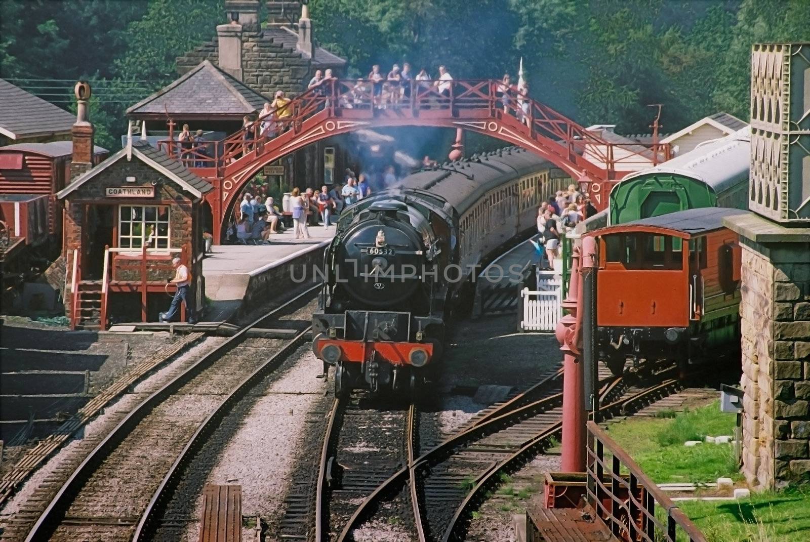 A steam engine pulls a train into Goatland station which often featured in the television series called Heartbeat.