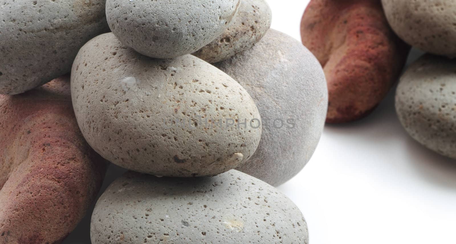 Two Piles of pebbles on white background