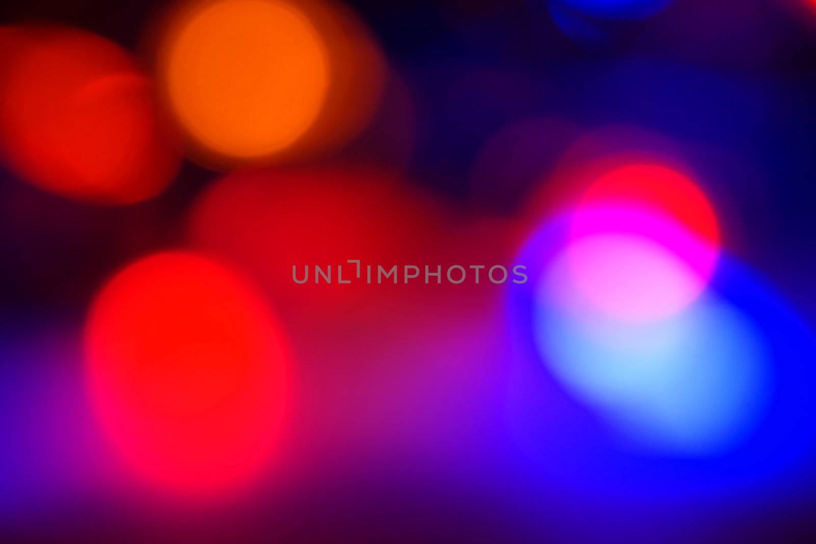 Out of focus LED multicolor Christmas lights providing the perfect holiday background for a design or card. 