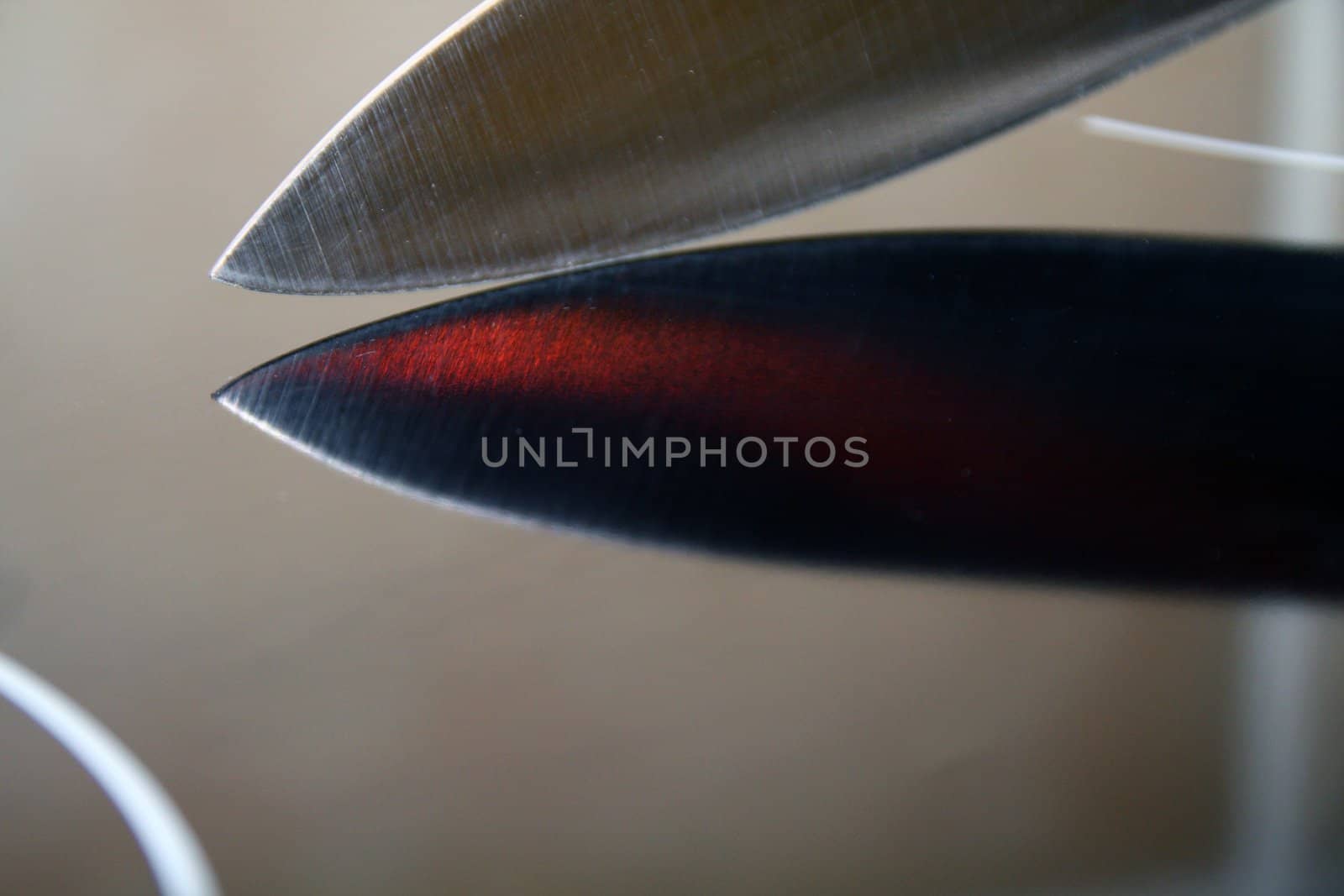 Knife blade on a reflective black surface by ChrisAlleaume