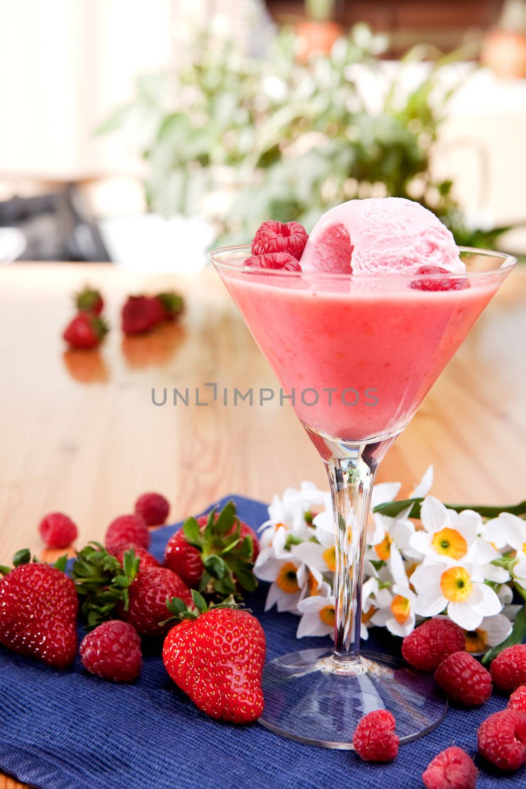 A fancy glass of milk shake smoothie made from fresh berries