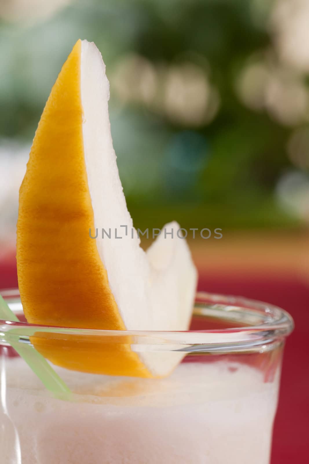 A sweet melon smoothie in an outdoor setting