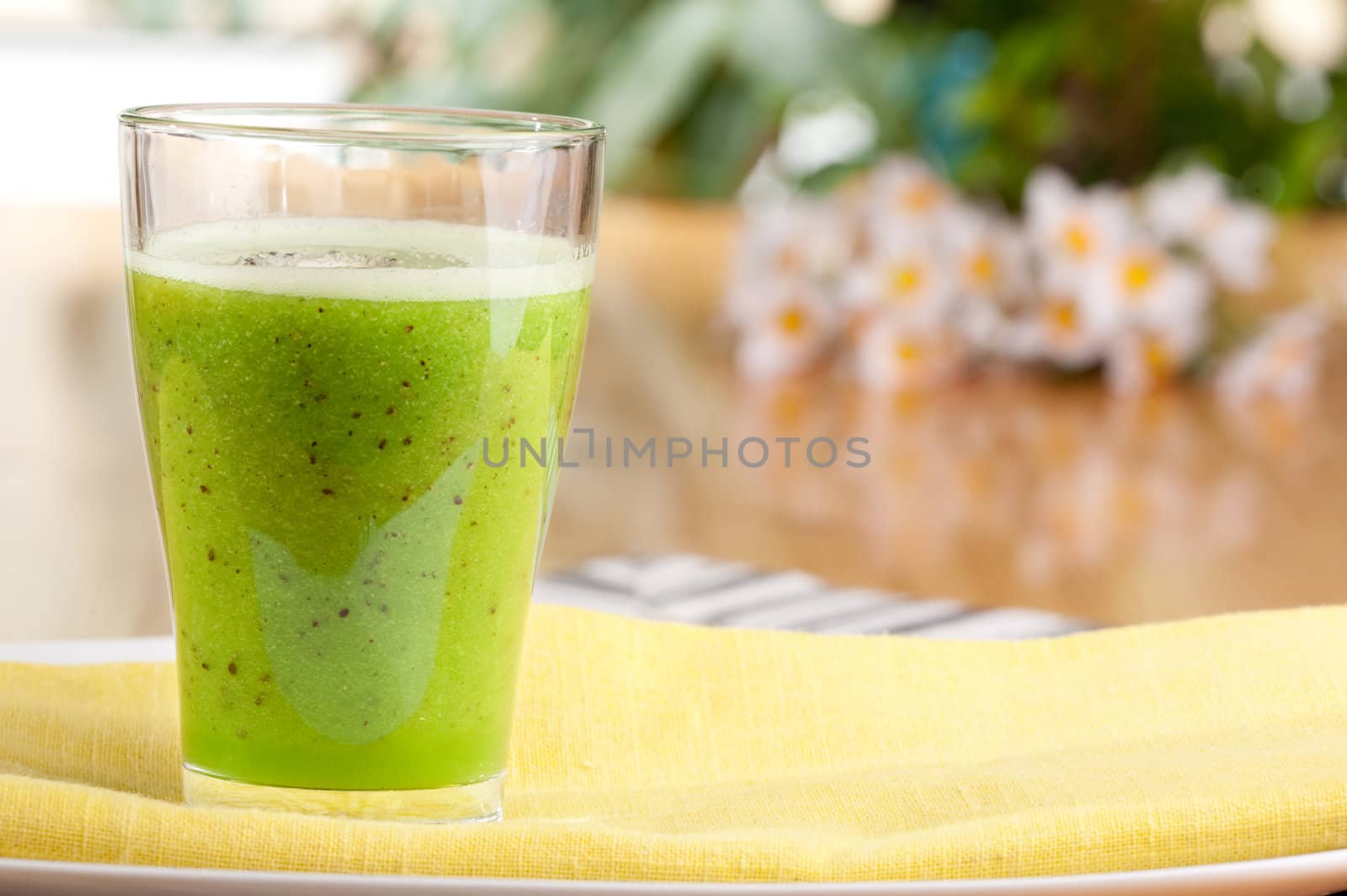 A tasty kiwi smoothie in a natural setting